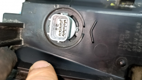 Left front headlight for a Honda Accord 18-22 Touring hybrid, needs polishing, cracked mount
