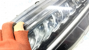Left front headlight for a Honda Accord 18-22 Touring hybrid, needs polishing, cracked mount