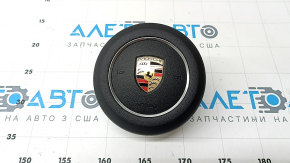 Black steering wheel airbag for the driver's side of the Porsche Cayenne 19-23.