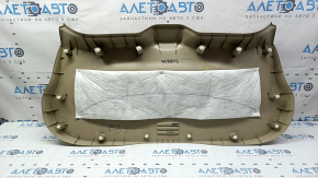 Lower tailgate trim for a 14-20 Nissan Rogue, beige, scratches, needs dry cleaning, plastic has turned white