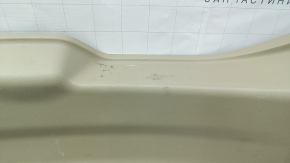Lower tailgate trim for a 14-20 Nissan Rogue, beige, scratches, needs dry cleaning, plastic has turned white
