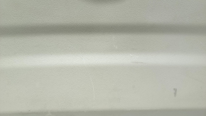 Lower tailgate trim for a 14-20 Nissan Rogue, beige, scratches, needs dry cleaning, plastic has turned white