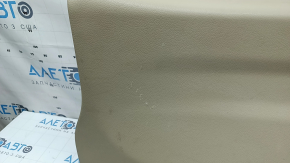 Lower tailgate trim for a 14-20 Nissan Rogue, beige, scratches, needs dry cleaning, plastic has turned white