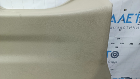Lower tailgate trim for a 14-20 Nissan Rogue, beige, scratches, needs dry cleaning, plastic has turned white