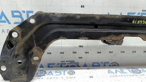 The lower TV bar of a 1920 Nissan Rogue is rusty.