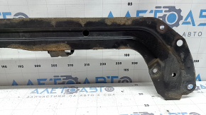 The lower TV bar of a 1920 Nissan Rogue is rusty.
