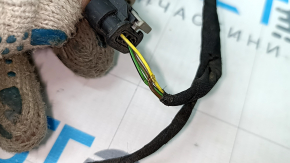 The wiring for the rear bumper of a 19-23 Porsche Cayenne for parking sensors is torn.