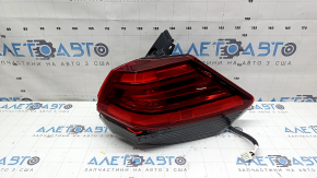 Nissan Rogue 17-20 right outer fender light has scratches and a missing piece of glass.