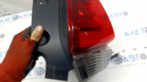 Nissan Rogue 17-20 right outer fender light has scratches and a missing piece of glass.