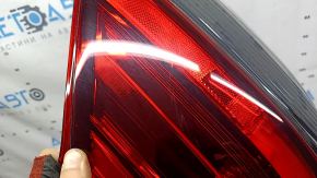 Nissan Rogue 17-20 right outer fender light has scratches and a missing piece of glass.
