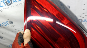 Nissan Rogue 17-20 right outer fender light has scratches and a missing piece of glass.