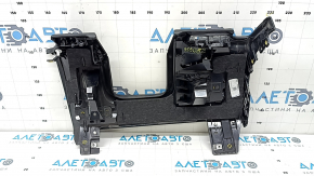 Black knee pad for the driver of a 19-23 Porsche Cayenne, dented