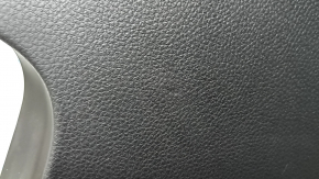 Black knee pad for the driver of a 19-23 Porsche Cayenne, dented