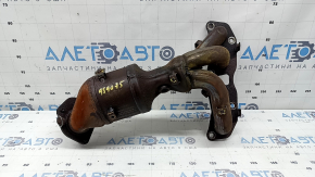 The exhaust manifold with a catalytic converter for a Nissan Rogue 14-17 type 1 is rusty and has broken bolts.