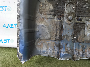 The trunk trough of a Honda Accord 23-26 is drilled out and dented.
