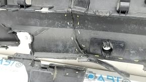 The rear bumper lip of a Porsche Cayenne 19-23, structured for parking sensors, Base, S, is broken, torn, scratched, and missing fragments.