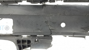 The rear bumper lip of a Porsche Cayenne 19-23, structured for parking sensors, Base, S, is broken, torn, scratched, and missing fragments.