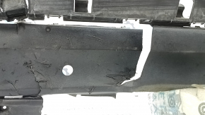 The rear bumper lip of a Porsche Cayenne 19-23, structured for parking sensors, Base, S, is broken, torn, scratched, and missing fragments.