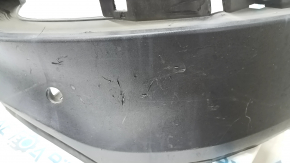 The rear bumper lip of a Porsche Cayenne 19-23, structured for parking sensors, Base, S, is broken, torn, scratched, and missing fragments.
