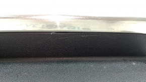 The trunk opening trim for a Porsche Cayenne 19-26 is black, with scratches and broken guides.