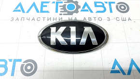 The Kia Sportage 17-22 trunk lid emblem has bulged.