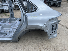 Rear left quarter wing of a 19-26 Porsche Cayenne on the body, silver, dented side member