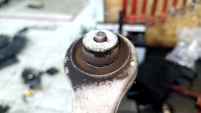 The upper front left control arm of a 19-26 Porsche Cayenne has a torn silent block.