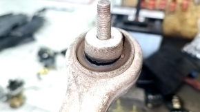 The upper front right rear control arm of a 19-26 Porsche Cayenne has a torn silent block.