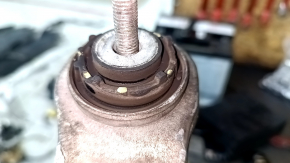 The lower front left control arm of a 19-26 Porsche Cayenne has a torn silent block.