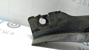 The front bumper guard, left, for a Porsche Cayenne 19-23, is dented and has tears.