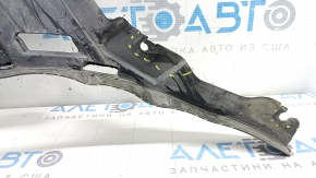 Right front bumper guard for Porsche Cayenne 19-23 is dented and torn.