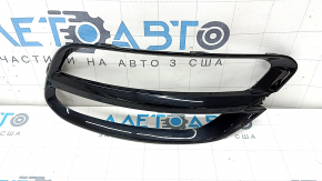 Left rear light trim on the bumper of a Kia Sportage 20-22, gloss black