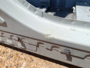 The right center pillar of a 2016 Ford Bronco Sport has a dent on the body.