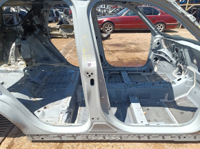 The right center pillar of a 2016 Ford Bronco Sport has a dent on the body.