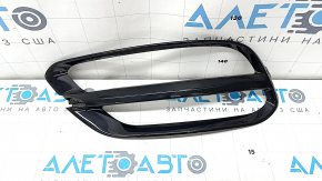 Right rear light trim on the bumper of a Kia Sportage 20-22, glossy black, worn