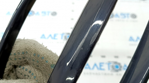 Right rear light trim on the bumper of a Kia Sportage 20-22, glossy black, worn