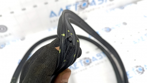 The rear left door seal of a 2021 Ford Bronco Sport has broken fasteners.