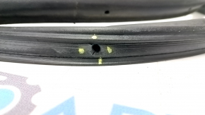 The rear right door seal of a 2021 Ford Bronco Sport has torn fasteners.