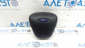 The driver's side steering wheel airbag for a Ford Edge 19-24 is black and has a rusty squib.