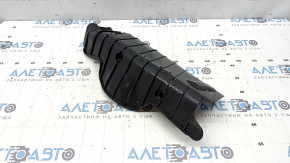 The rear right control arm lining under the spring of a Porsche Cayenne 19-26 has tears.