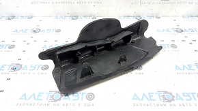 The rear left control arm lining under the spring of a Porsche Cayenne 19-26 has tears.