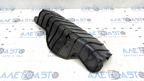 The rear left control arm lining under the spring of a Porsche Cayenne 19-26 has tears.