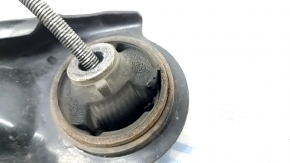 The lower front left control arm of a Nissan Rogue Sport 17-22 has a torn silent block.