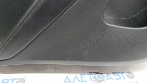 Rear left door panel for a 2022 Nissan Rogue Sport, black with black insert, black leather armrest, scratches