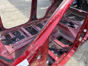Front left quarter panel of a Kia Sportage 20-22 on the body, red, dented pillar
