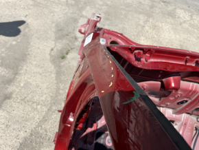 Front left quarter panel of a Kia Sportage 20-22 on the body, red, dented pillar