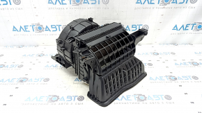 The bare heater housing of a Kia Sportage 18-22 without a fan, actuator, or resistor.
