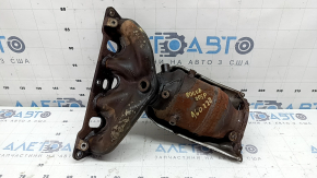 The exhaust manifold with a catalytic converter for a 2021 Nissan Rogue Sport is rusty, the studs are sawed off, and the bolts are broken.