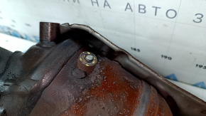 The exhaust manifold with a catalytic converter for a 2021 Nissan Rogue Sport is rusty, the studs are sawed off, and the bolts are broken.