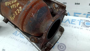The exhaust manifold with a catalytic converter for a 2021 Nissan Rogue Sport is rusty, the studs are sawed off, and the bolts are broken.